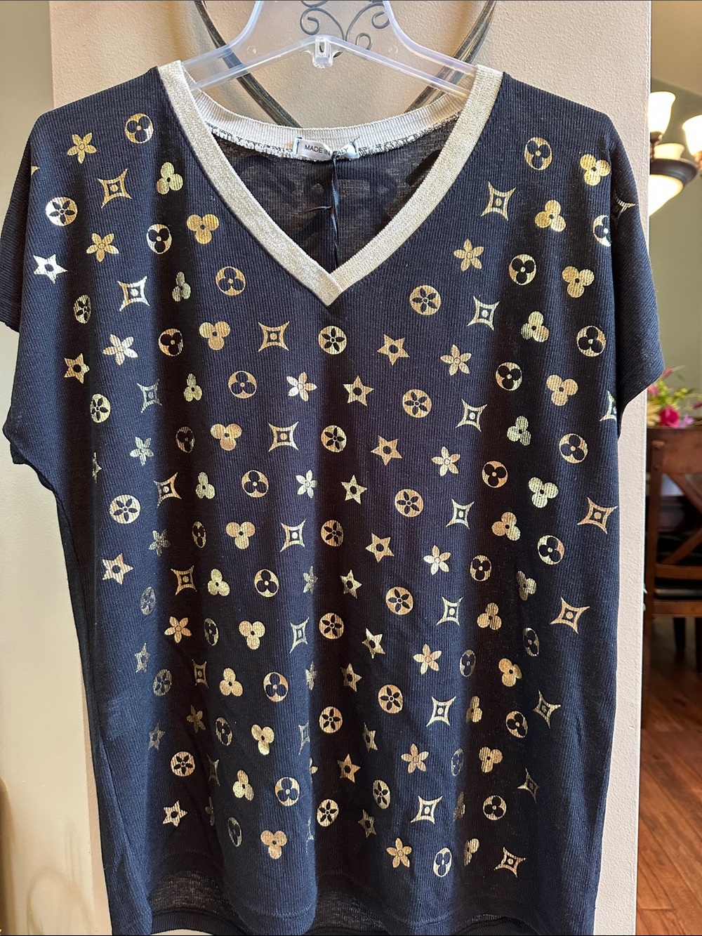Black Short-Sleeve V-Neck Tee with Metallic Gold Star and Clover Motif